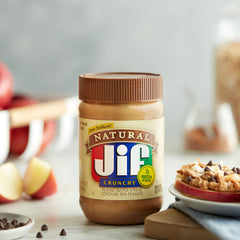 Spoon spreading Jif on bread to show ease of use and taste