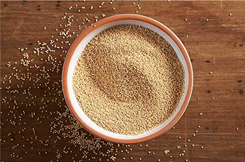 Jiva Organics amaranth flour in bowl beside pancakes, showing versatile cooking use