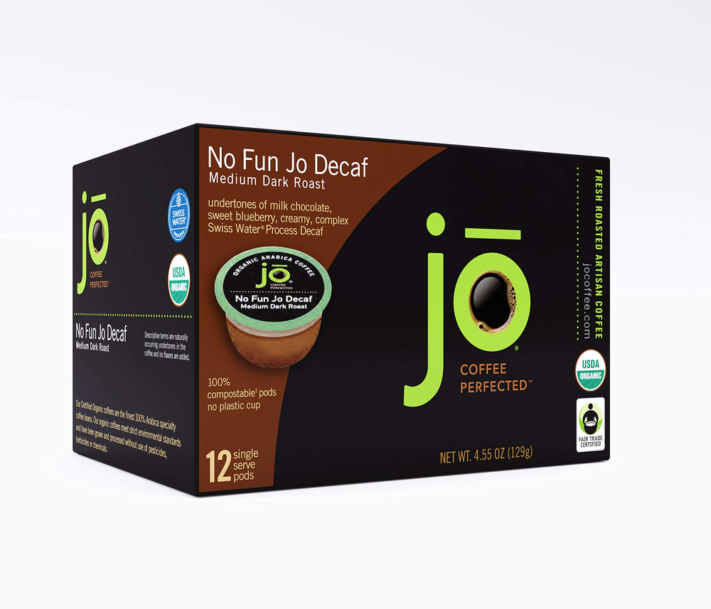 Jo Coffee pod close-up showing compostable texture and rich grind