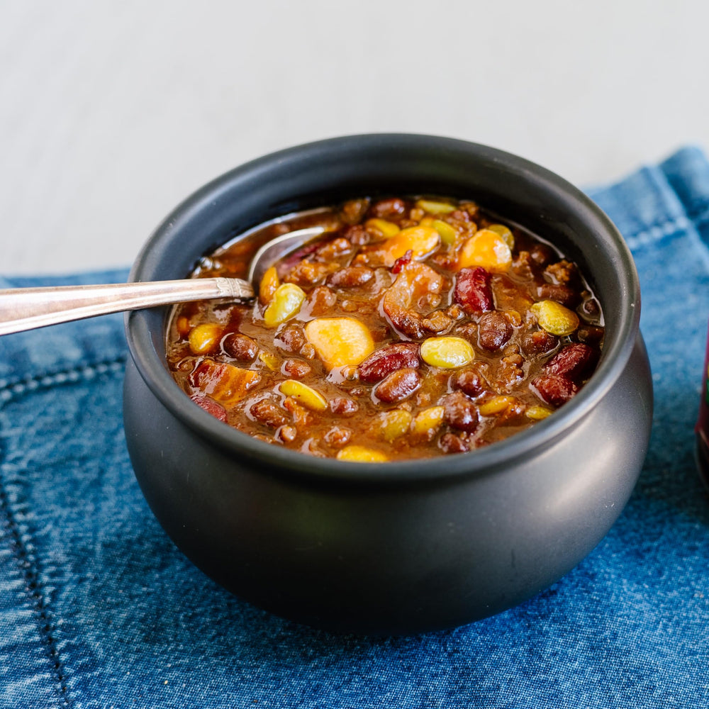 Close-up of Joan of Arc beans highlighting texture and hearty chili seasoning benefit