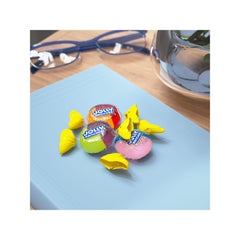 Jolly Rancher next to a coin to show scale and easy pocketable portability