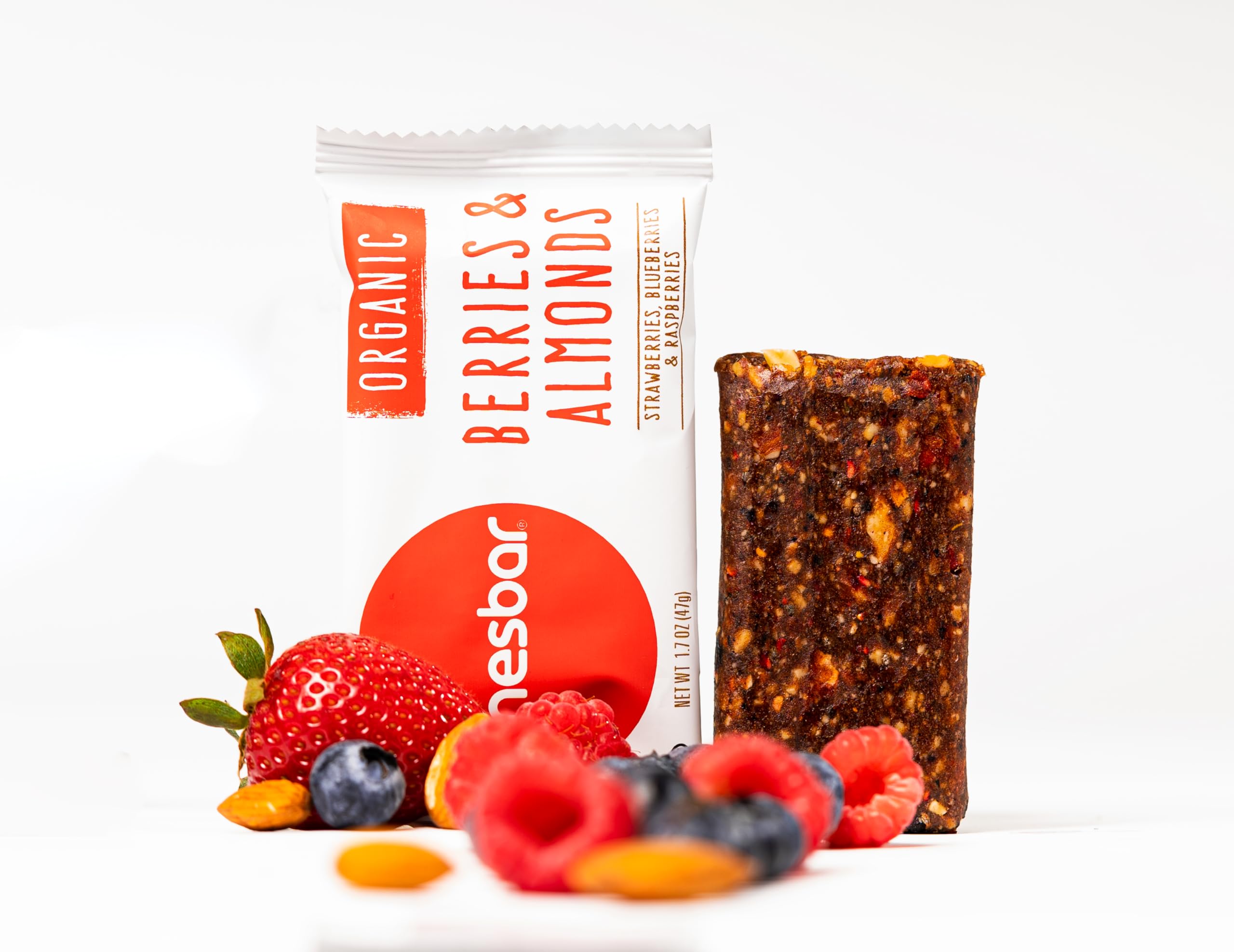 jonesbar beside smartphone to show 1.7 oz scale and portable convenience for on-the-go snacking