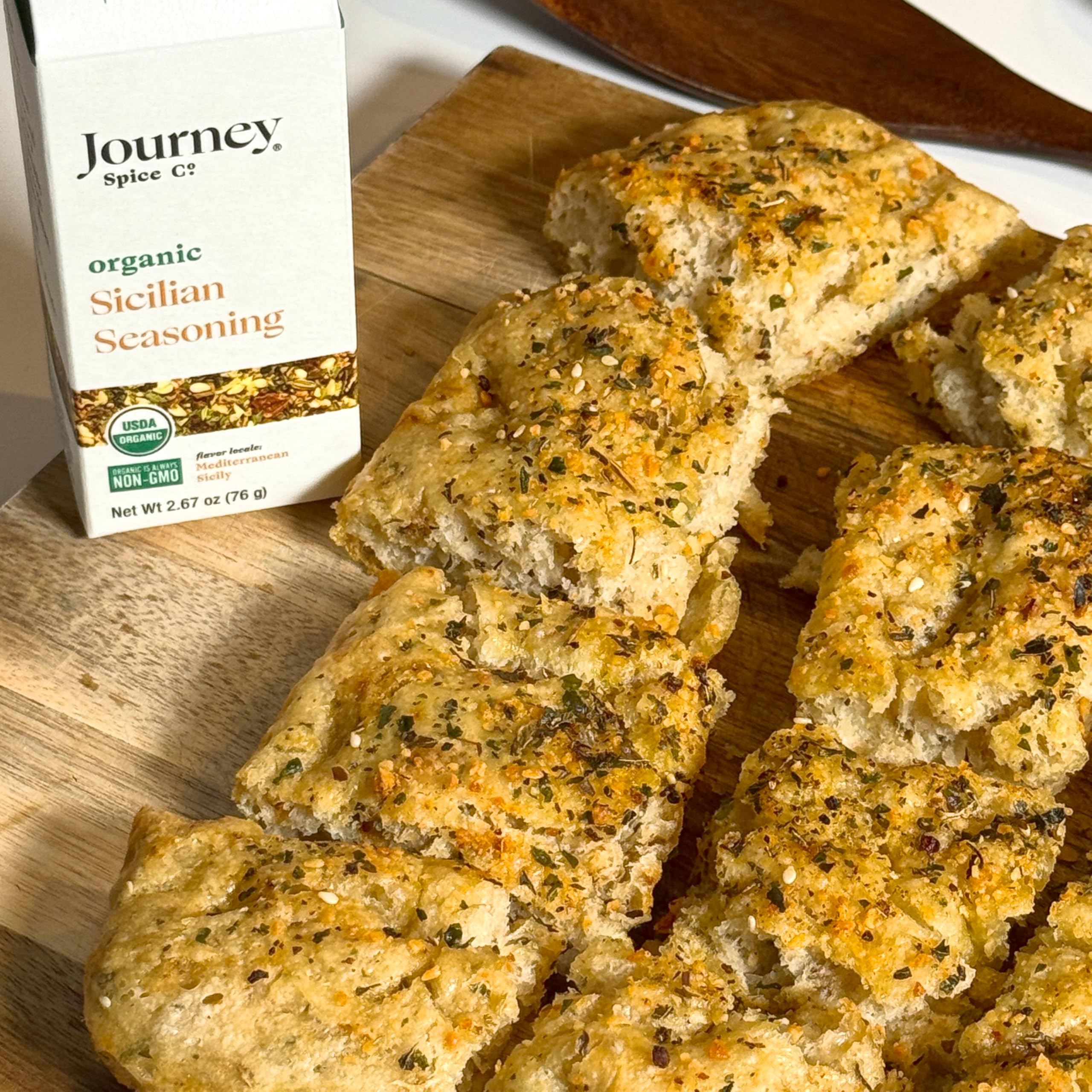 Journey Spice Co. paper-based packaging and resealable cap emphasizing eco benefits