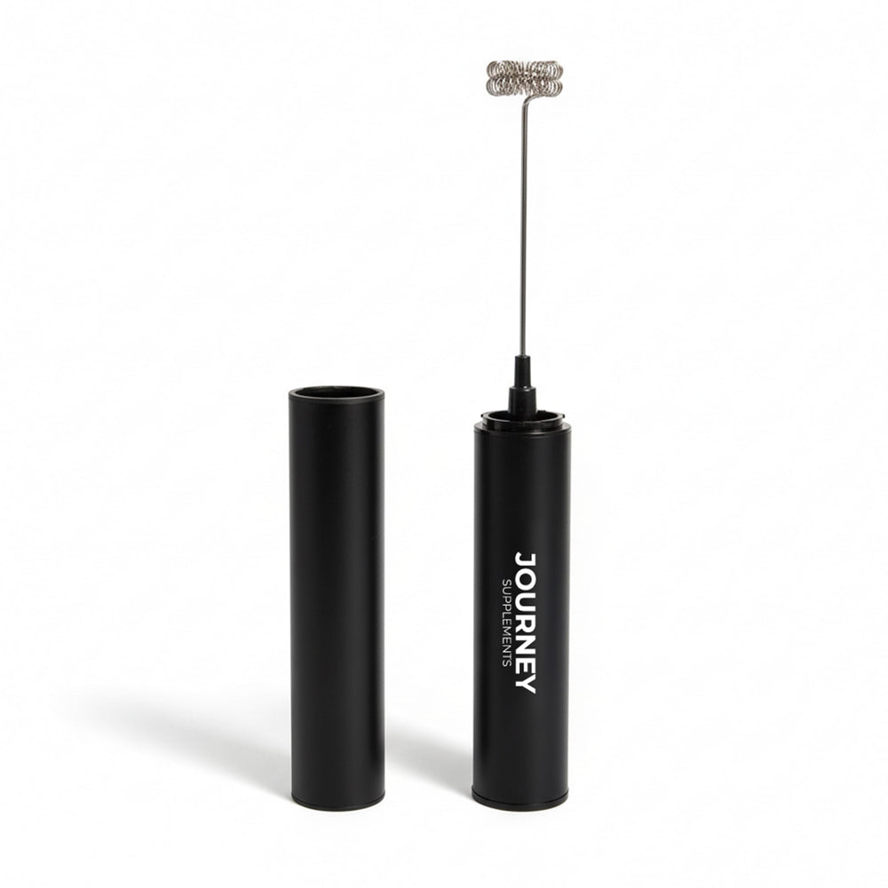 Journey Supplements handheld frother creating creamy foam for cafe-style drinks on the go