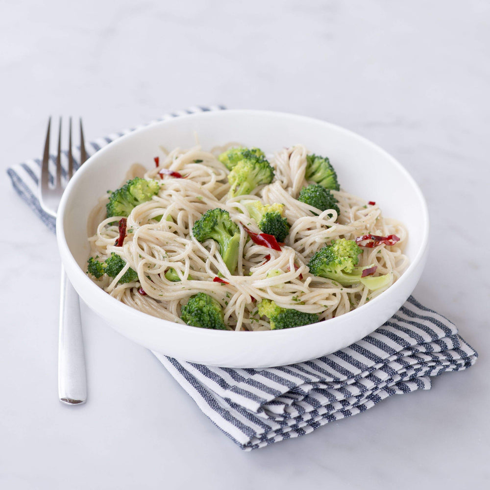 Jovial capellini plated with light sauce highlighting delicate structure