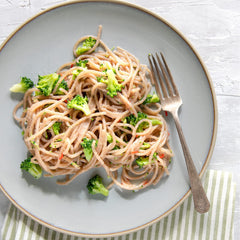 Jovial close-up of cassava noodle texture highlighting firm sauce adhesion