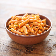 Jovial plated cooked einkorn penne showing appetizing texture and color