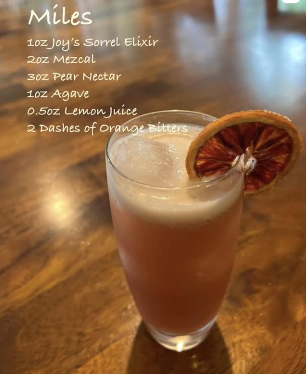 Joy's Island Spice mixed cocktail with citrus garnish for elevated cocktails