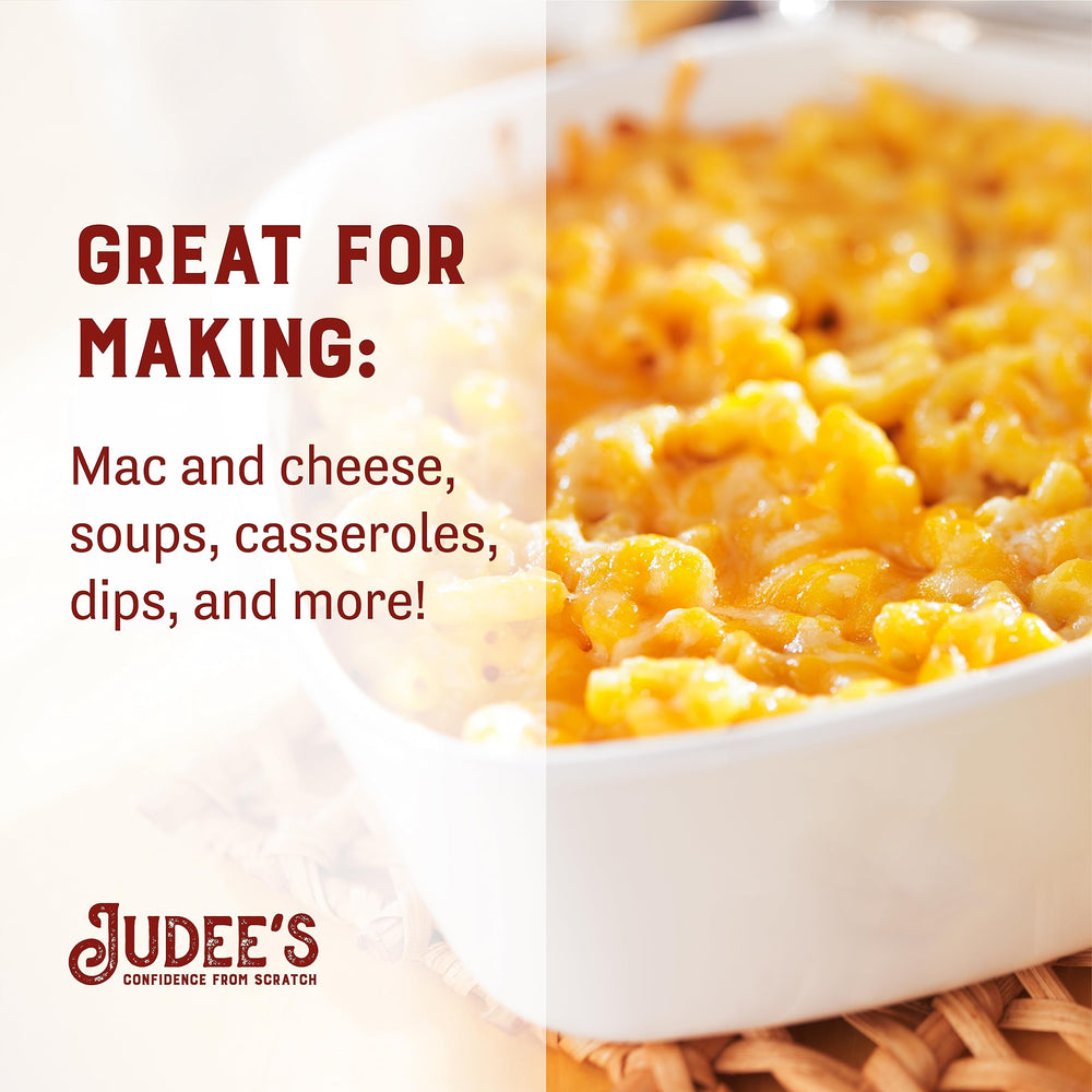 Judee's powder dusted on popcorn showing bold cheddar flavor boost