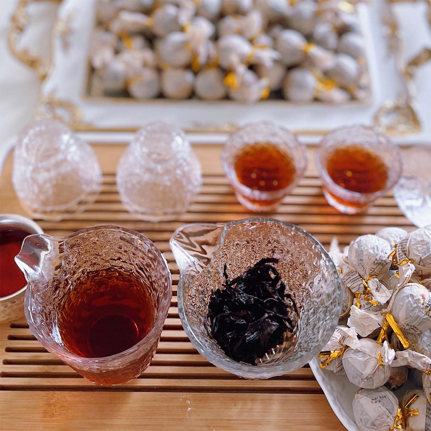 Junn Shenn lifestyle scene pouring tea into a pot for serving and warm hospitality