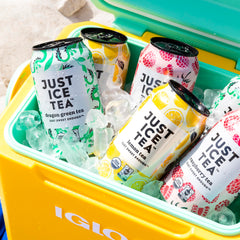 Just Ice Tea organic black tea leaves and lemon slices, emphasizing real-brewed ingredients