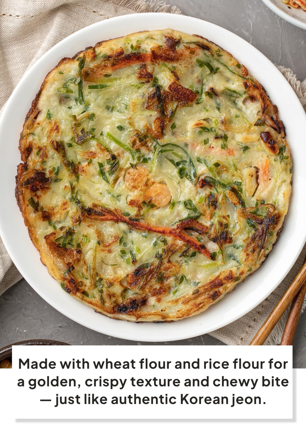 k food korean food pancake sizzling in skillet, showing golden crispy edges