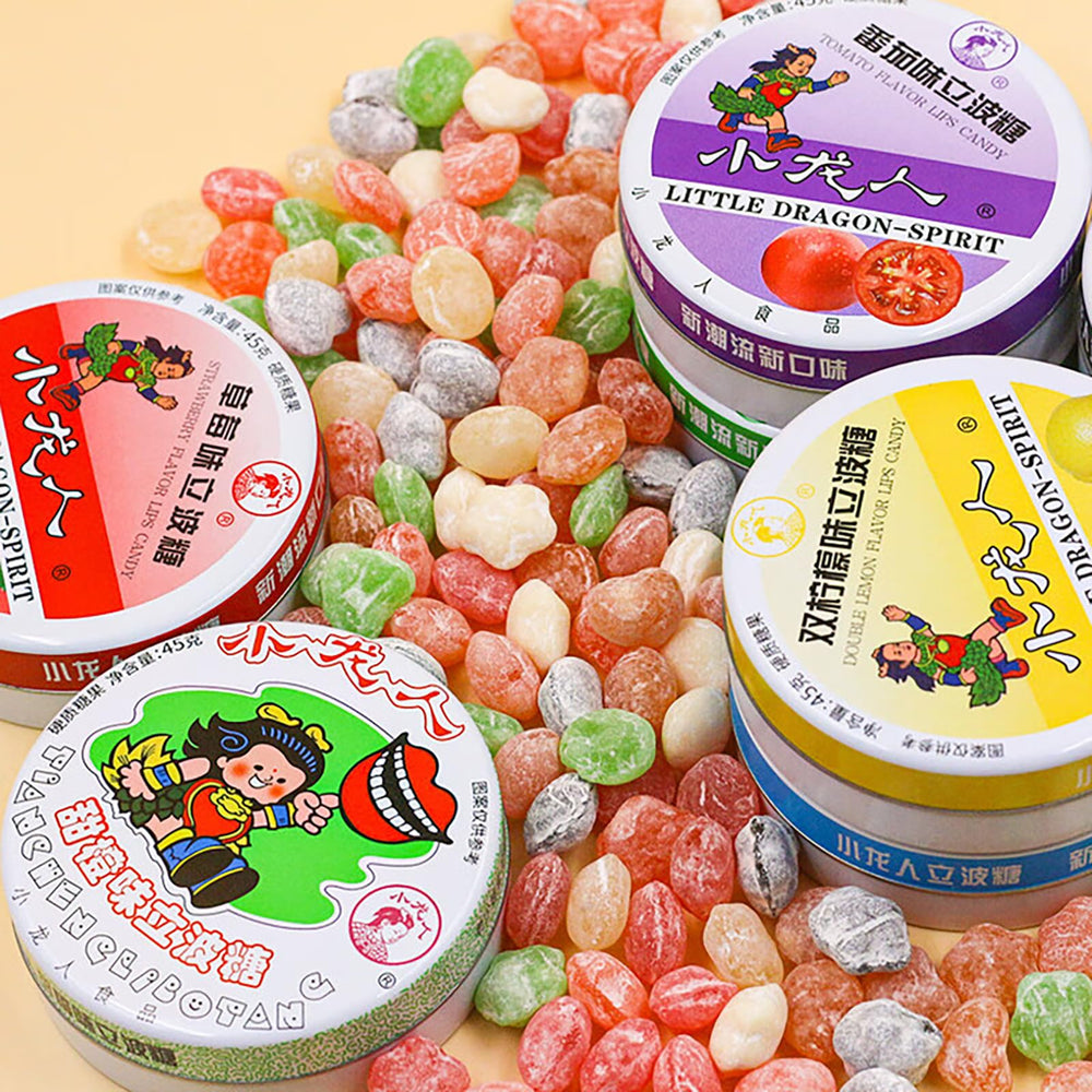 KachiKachi tins on party table with guests, perfect for sharing and favors