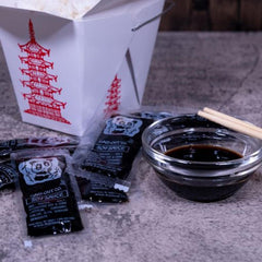 Close-up of Kari-Out soy sauce packet seal and texture highlighting hygienic single-serve