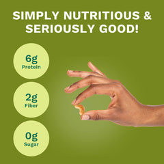 Karma hand holding single 1.5oz pack, demonstrates compact size for travel