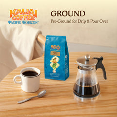 24 oz Kauai Coffee bag beside a mug demonstrating generous household size