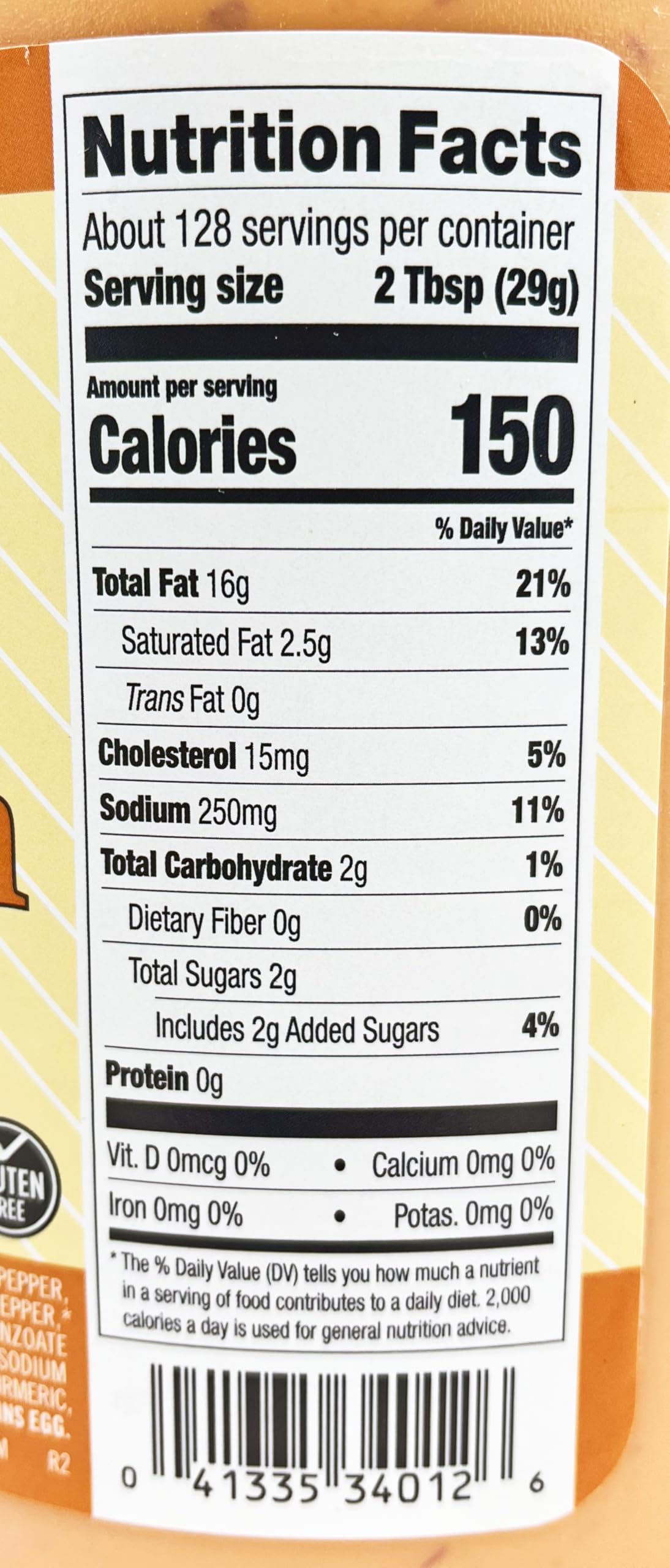 Ken's Boom Boom Sauce next to measuring cup showing one-gallon scale and storage