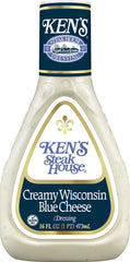 Ken's Steak House pouring thick creamy blue cheese dressing to show texture and creaminess