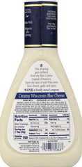 Ken's Steak House dressing drizzled on salad delivering bold blue cheese flavor contrast