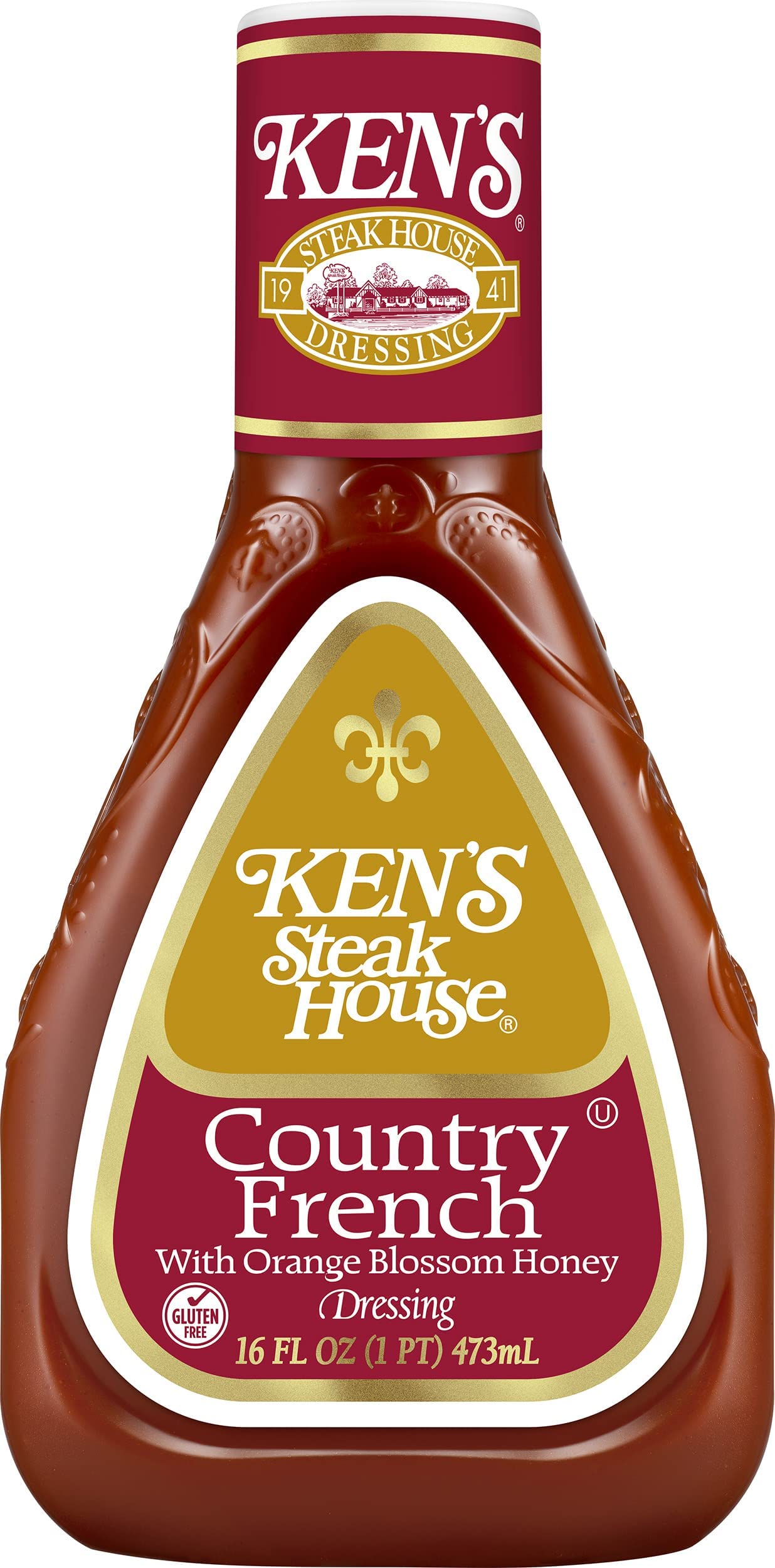 Ken's Steak House pouring dressing on mixed salad for added flavor