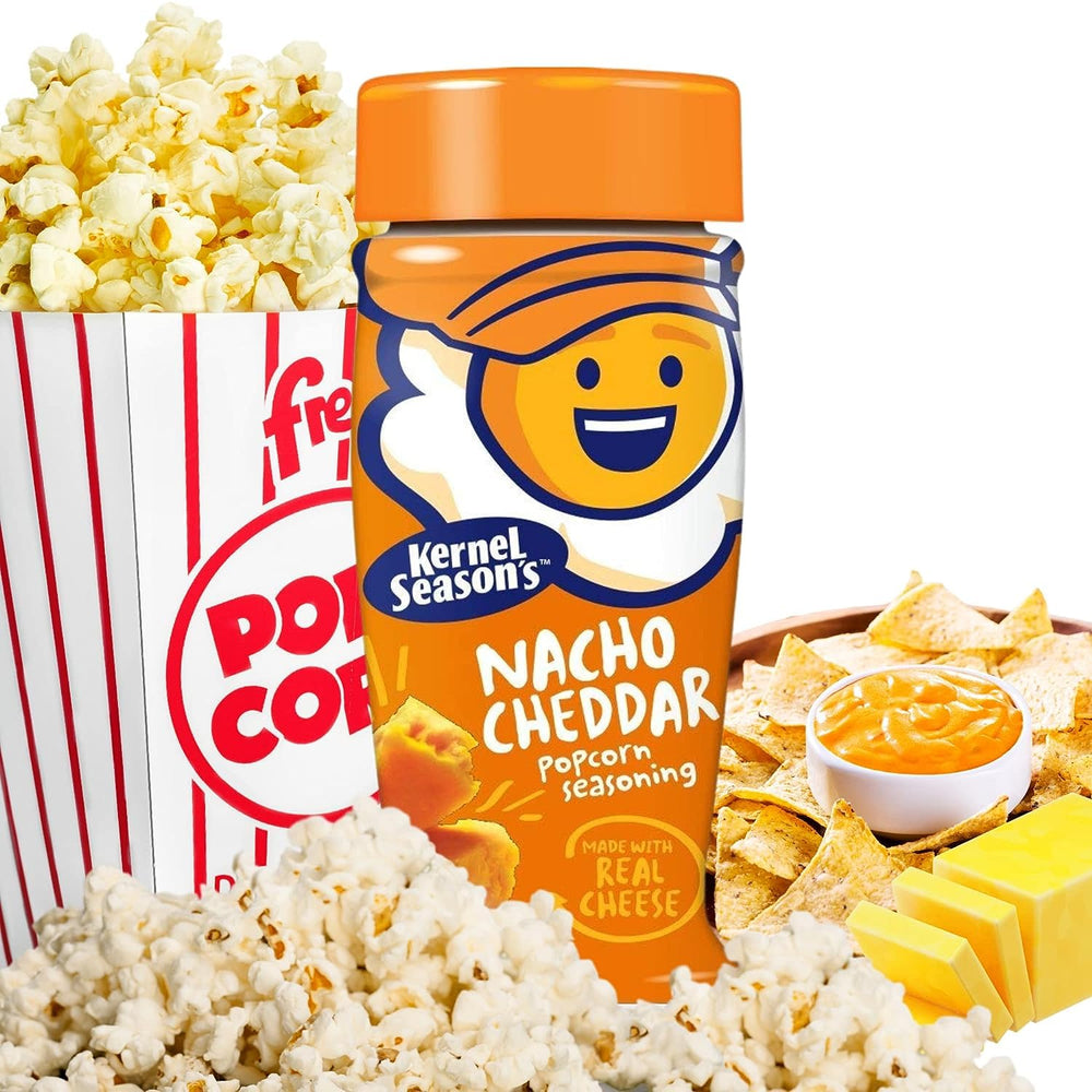 Kernel Season's seasoning sprinkled on warm popcorn delivering bold cheddar flavor