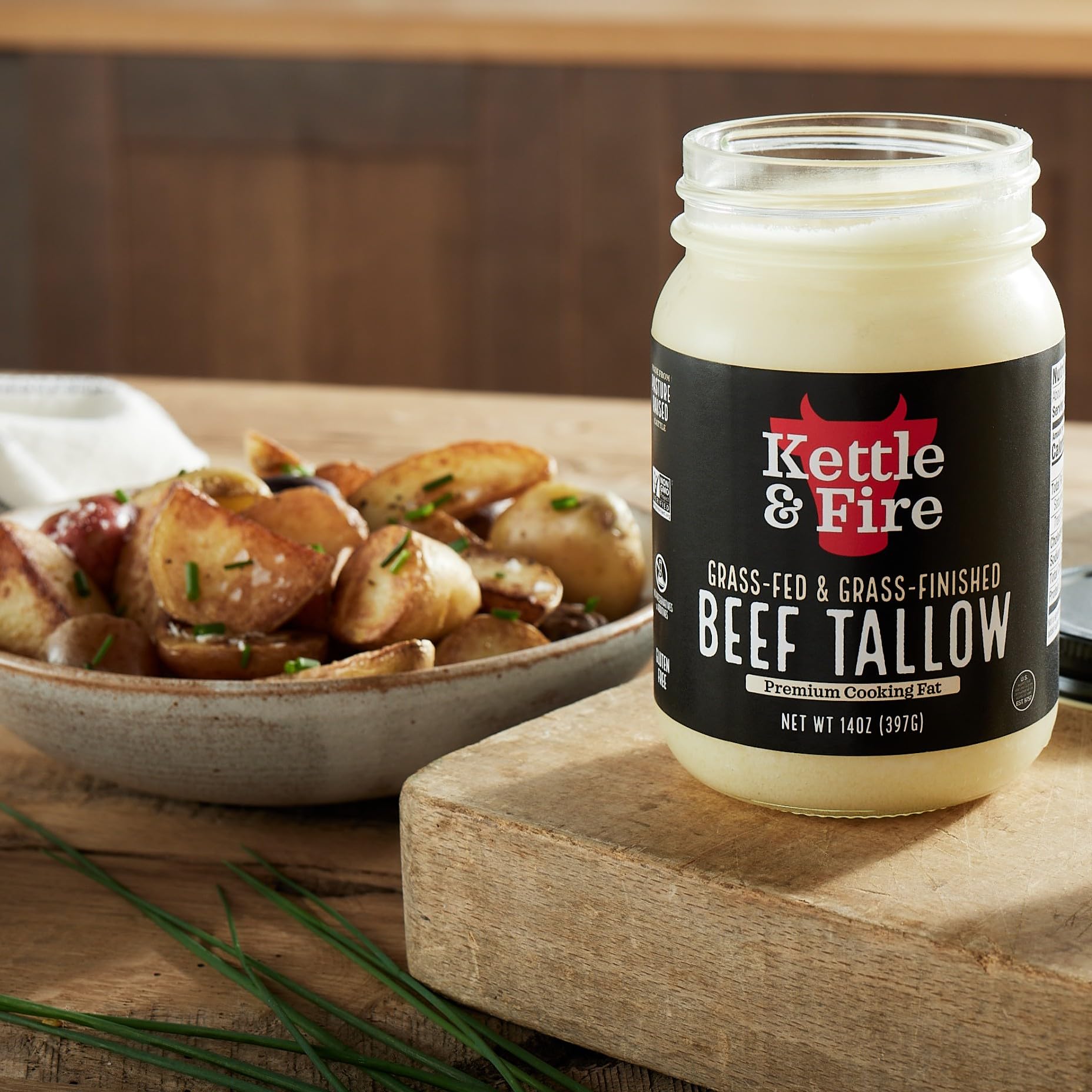 Kettle & Fire pouring tallow into skillet for high-heat cooking