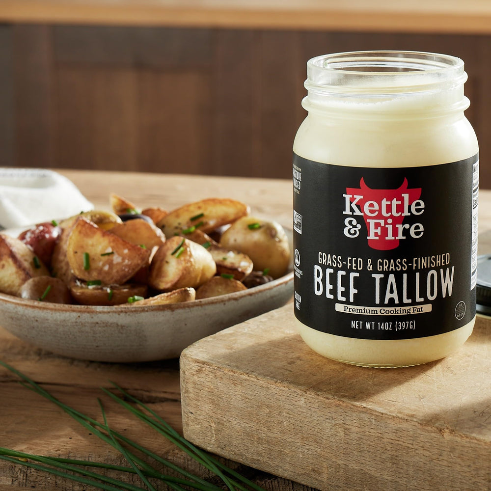 Kettle & Fire pouring tallow into skillet for high-heat cooking