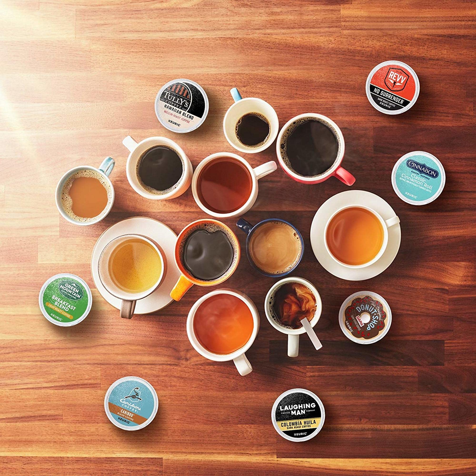 Hand holding a Keurig K-Cup pod for size comparison and easy single-serve impact