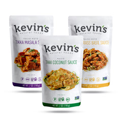Kevin's Natural Foods trio front packaging shows all three sauces and highlights clean ingredients