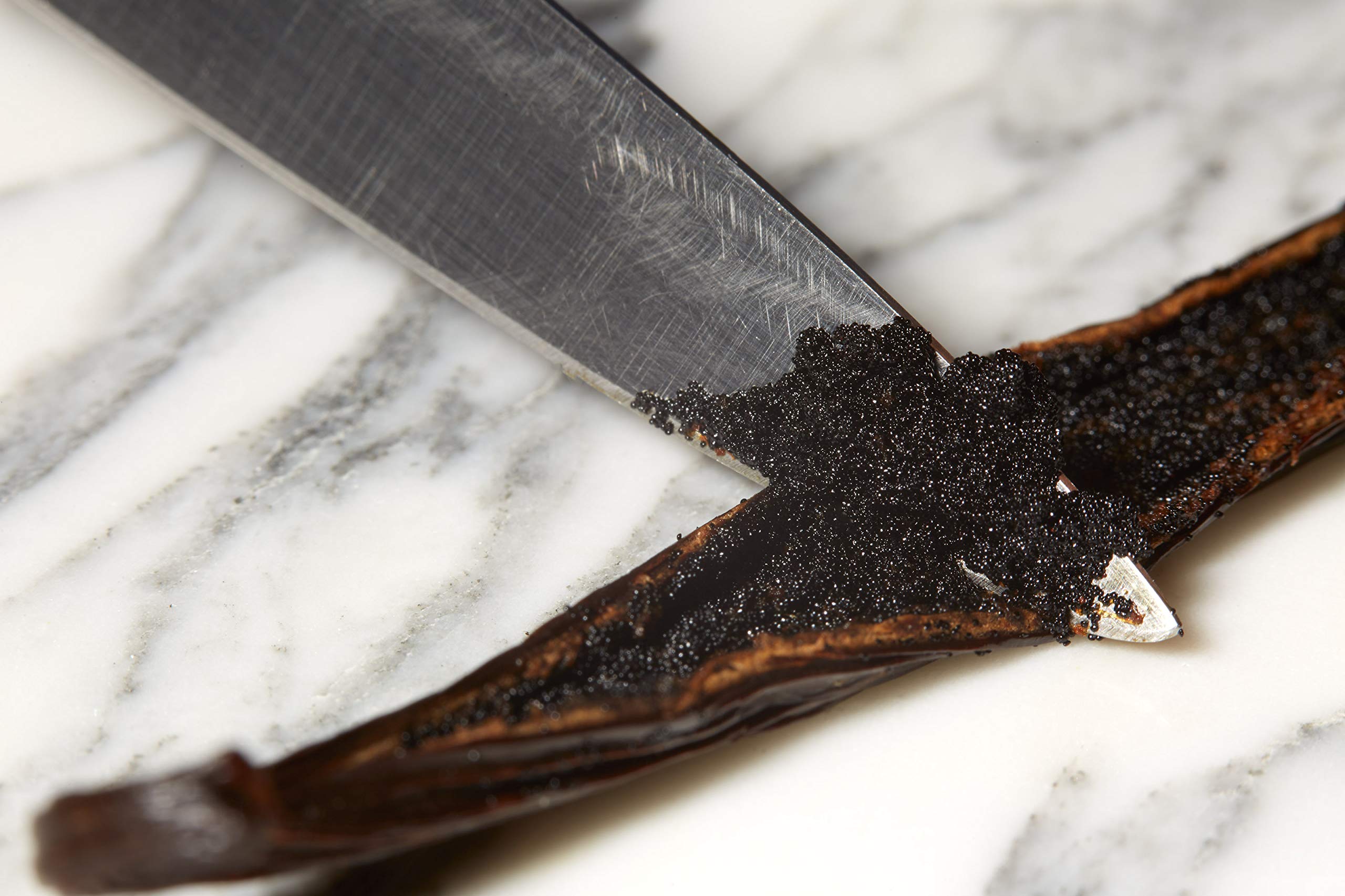 Kiddu vanilla beans on kitchen counter being used for baking benefit: authentic flavor