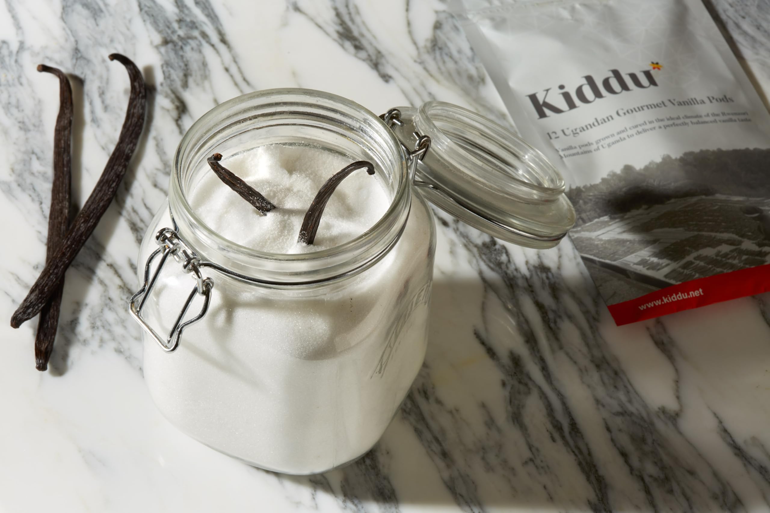 Kiddu vanilla beans beside ruler showing 15–20cm length benefit: consistent sizing