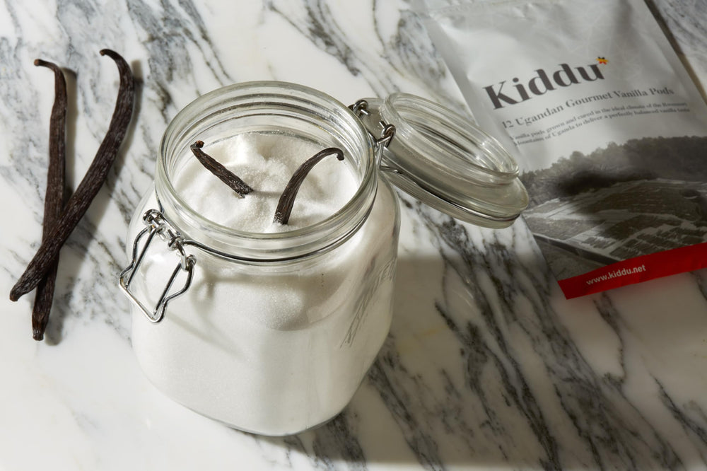 Kiddu vanilla beans beside ruler showing 15–20cm length benefit: consistent sizing