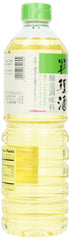 Kikkoman Ryorishi bottle next to a tablespoon for scale, showing 33.8 oz serving size and portion guidance