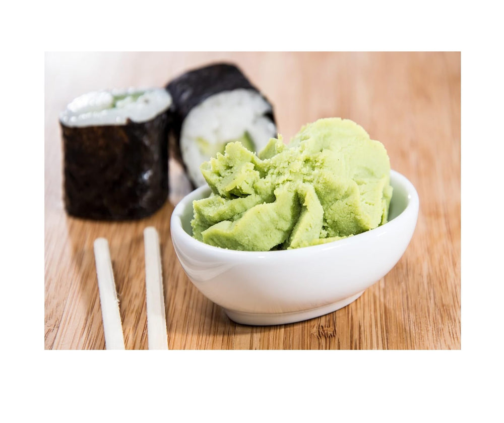 bottle of kikkoman wasabi next to glaze bowl demonstrating marinade and glaze use