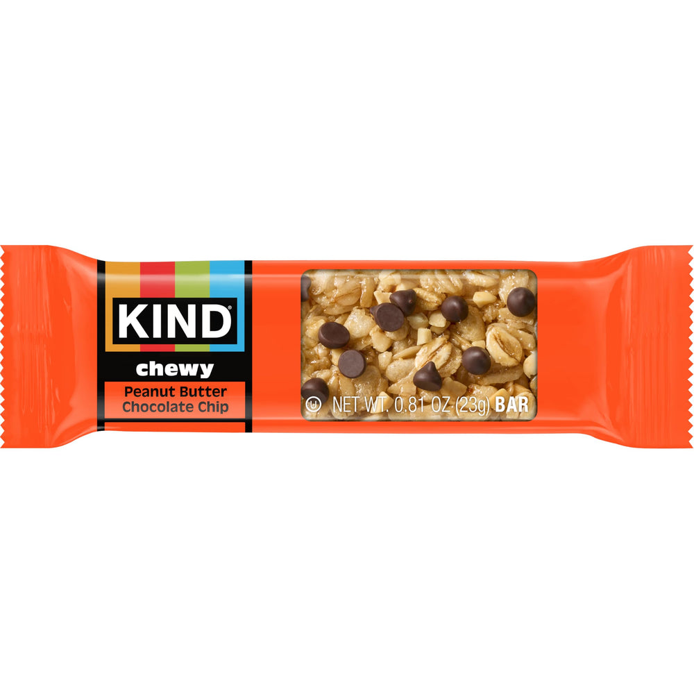 KIND bars in a lunchbox beside fruit demonstrating convenient, wholesome snacking