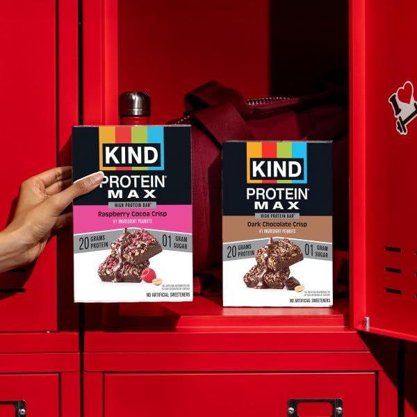 KIND Protein MAX bar outdoors in hand showing portable snack benefit for activities