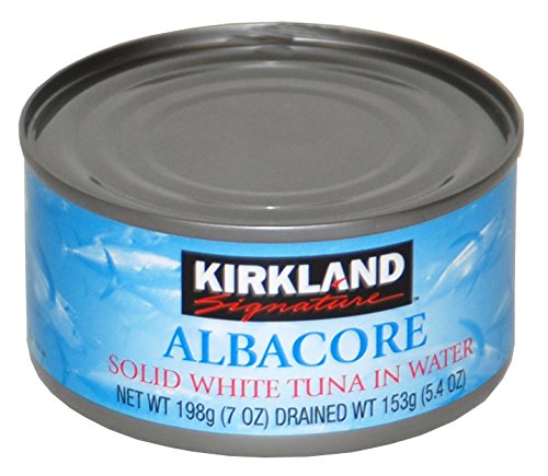 Kirkland open can showing solid white albacore flakes, firm texture for salads and recipes