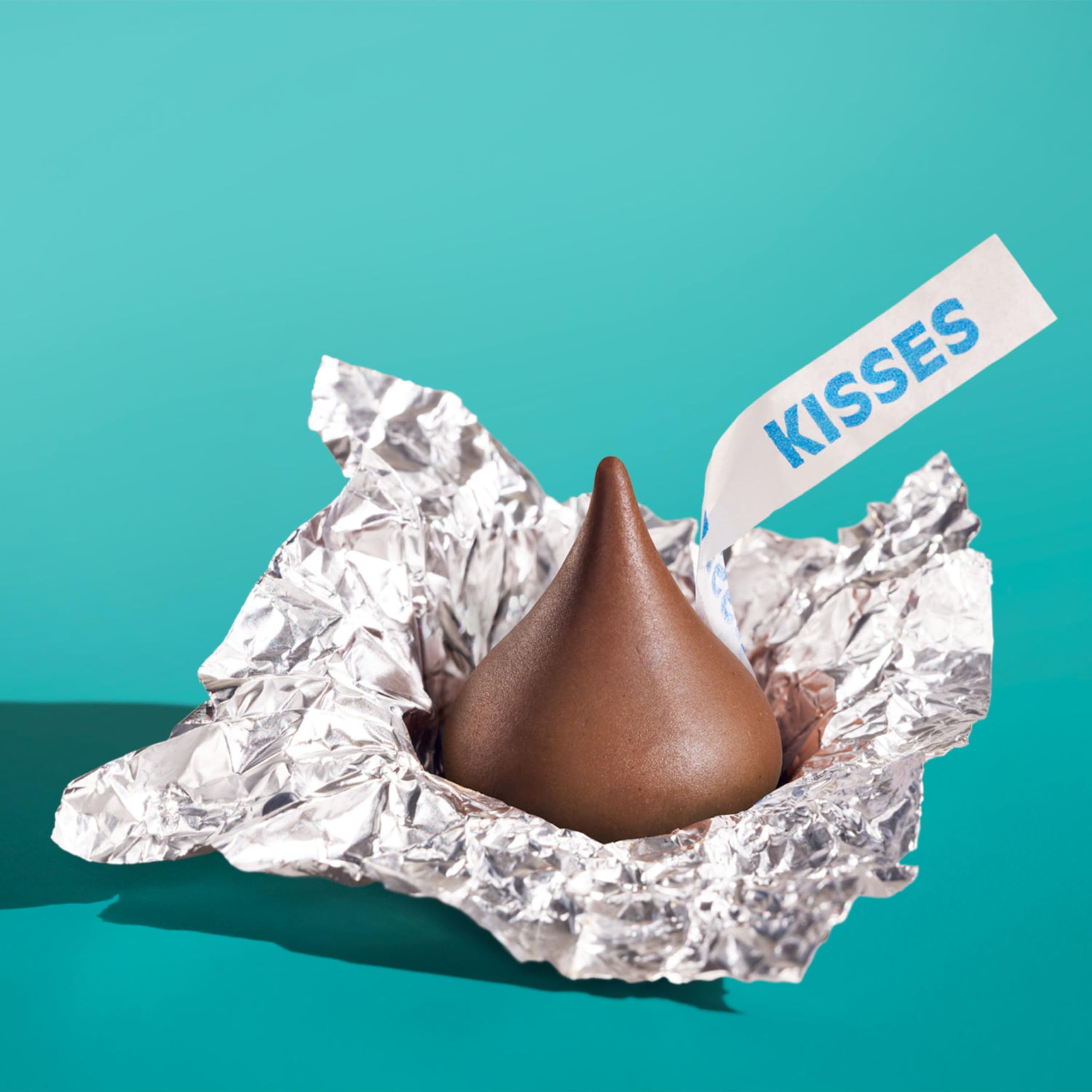 HERSHEY'S KISSES beside a ruler for size comparison and portion clarity