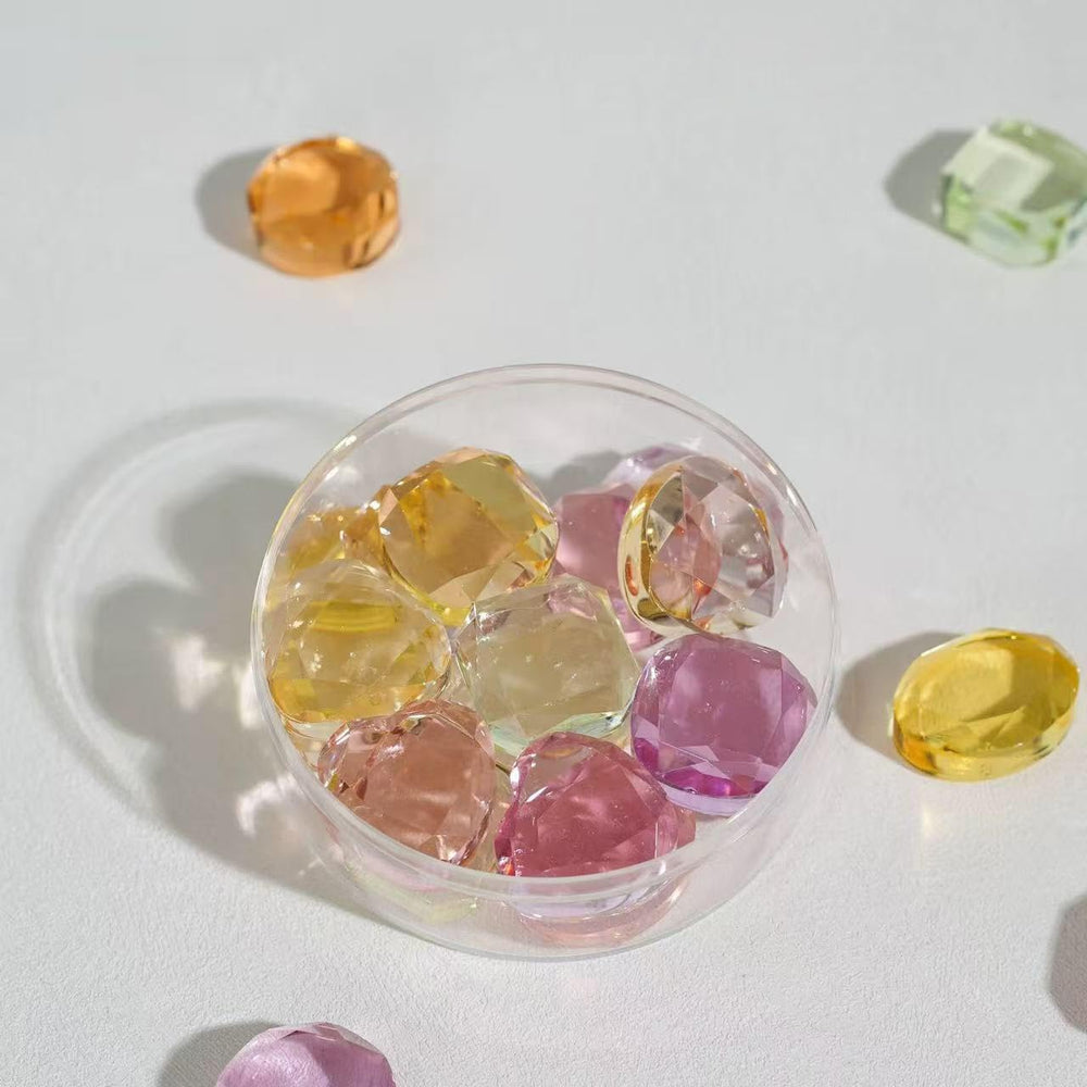 Klevra gems beside a coin to show scale and practical sizing for decoration