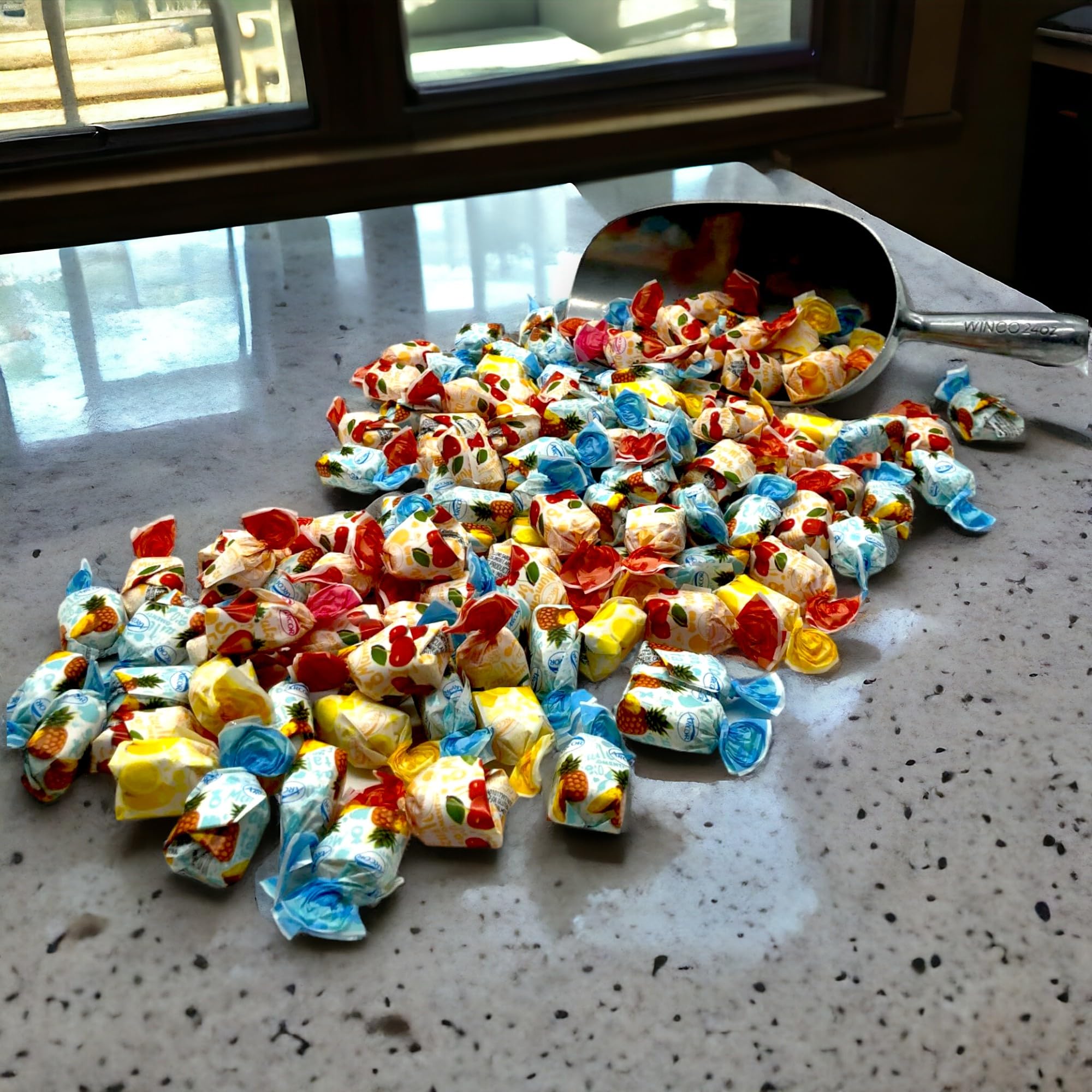 KLUB BULK hand holding candies to show size and generous 1.5 lb quantity benefit