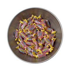 size comparison of Klub Bulk Jolly Ranchers bag next to a common object showing scale and quantity benefit