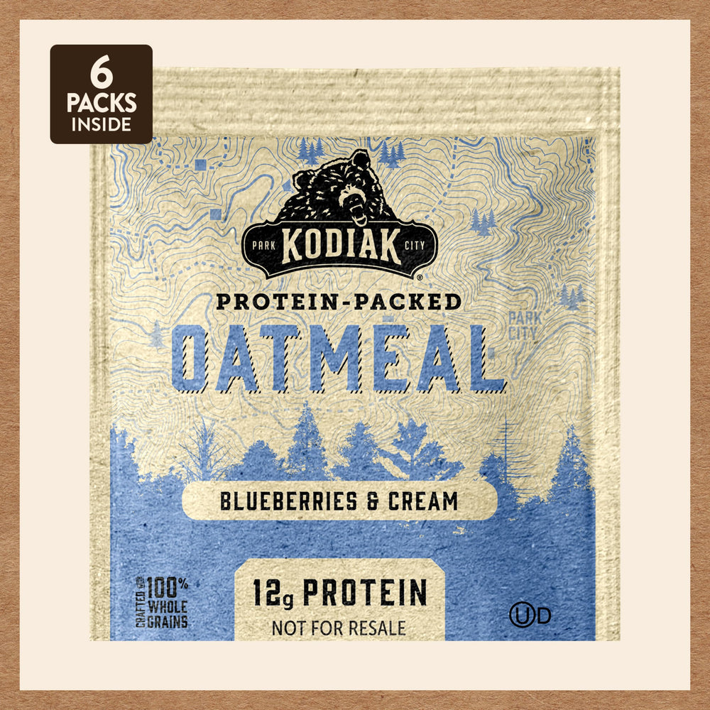 Kodiak Cakes oatmeal on a breakfast table with cup of coffee, suggests easy mornings