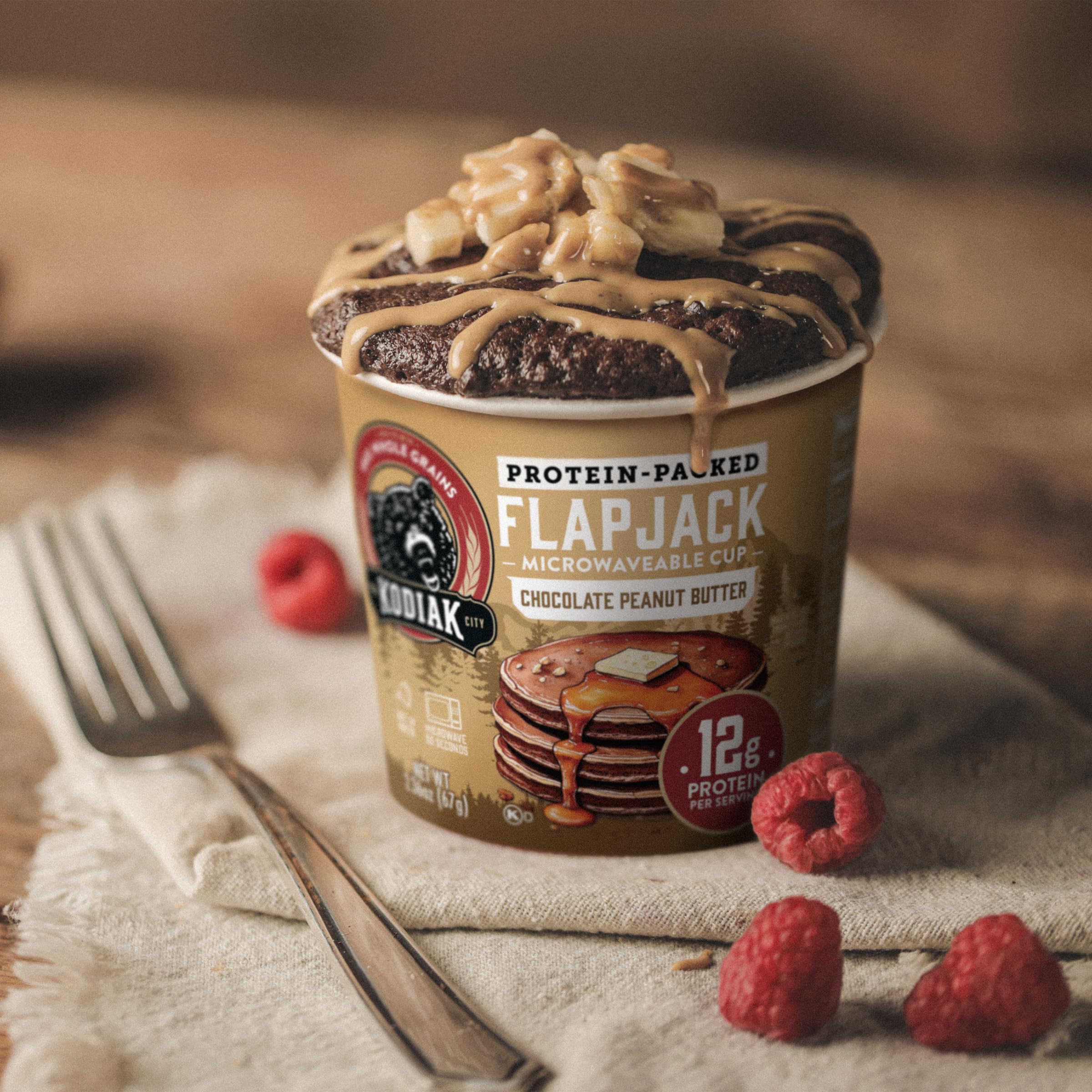Kodiak Cakes on a breakfast table with fruit showing convenient on-the-go benefit