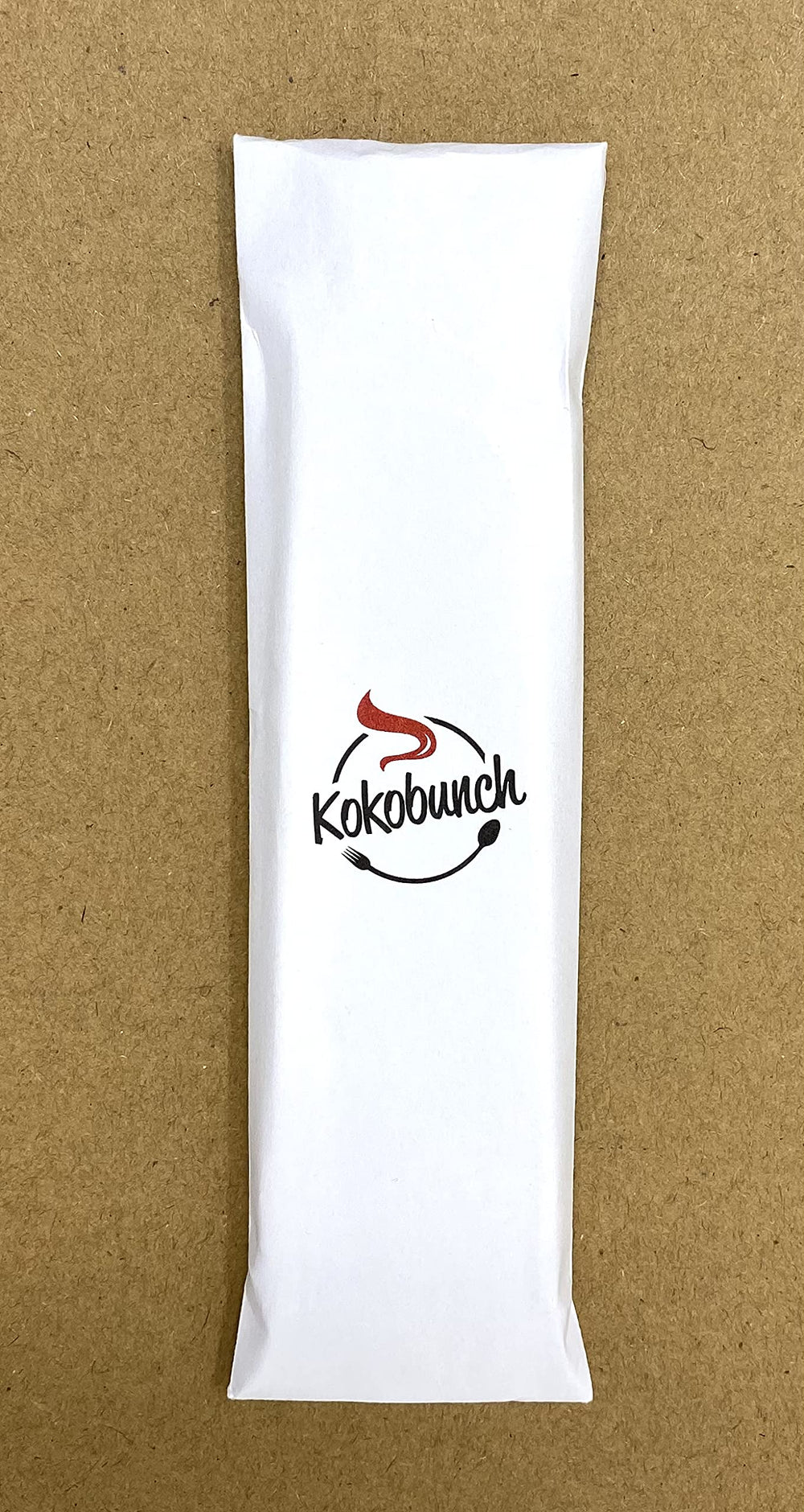 KOKOBUNCH size comparison beside a hand, demonstrates portable 5.5oz bag convenience
