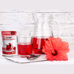 KomBei hibiscus flowers next to measuring spoon showing quantity and portion control