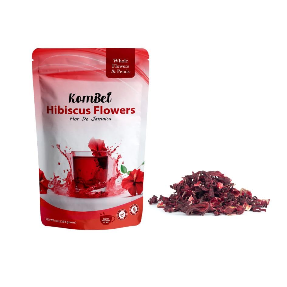 KomBei pouring brewed hibiscus tea into glass showcasing deep red color and refreshment