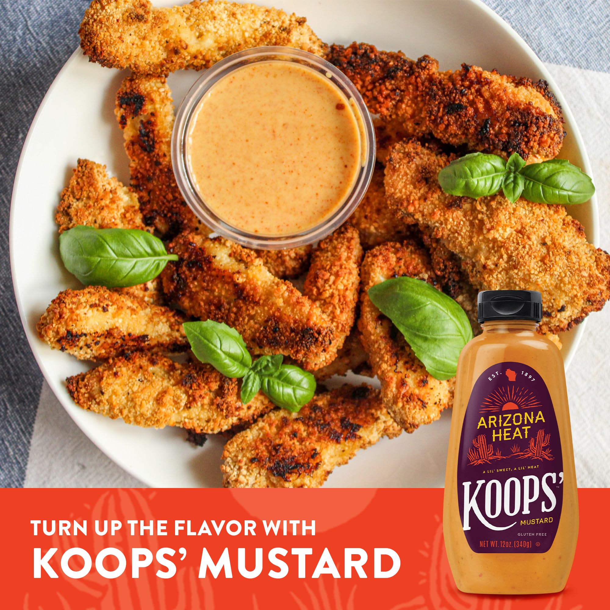 KOOPS' mustard on a picnic table at a barbecue for crowd-pleasing taste