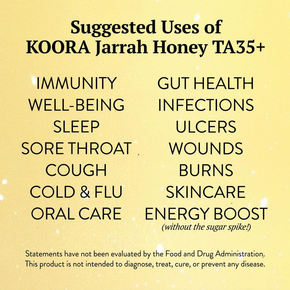 KOORA jarrah honey open jar with wooden dipper showing easy serving and raw texture