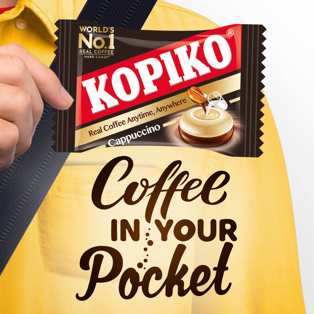kopiko candy held in hand to illustrate compact size and portability