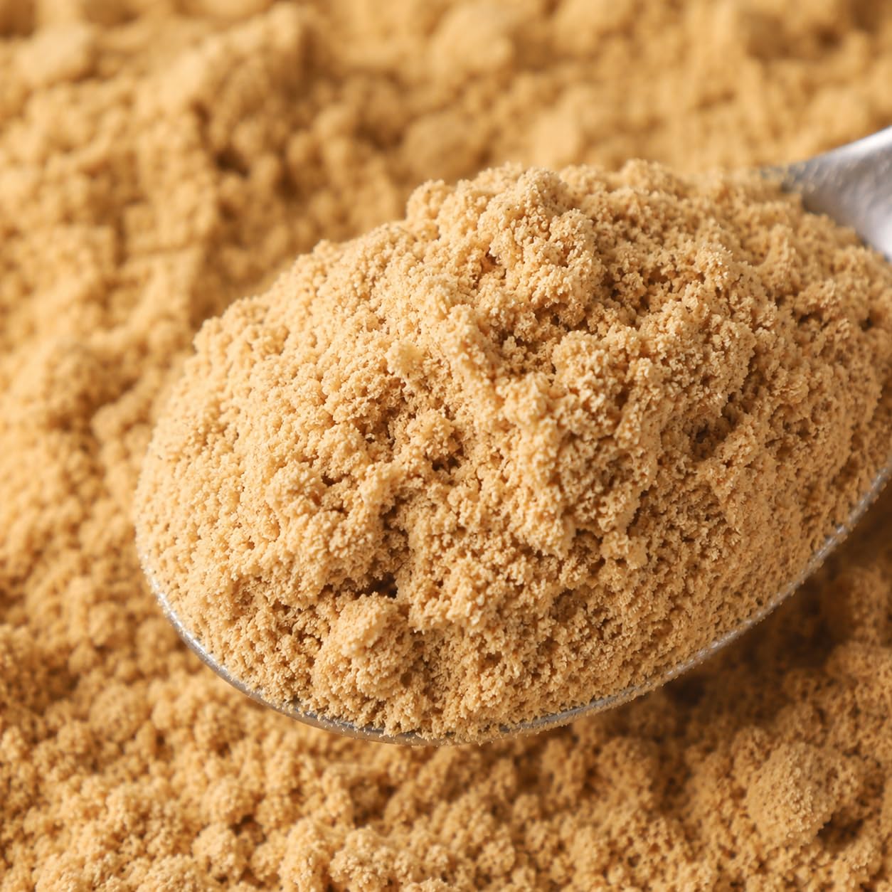 KorGourmetta powder on a measuring spoon to illustrate portion control and potency